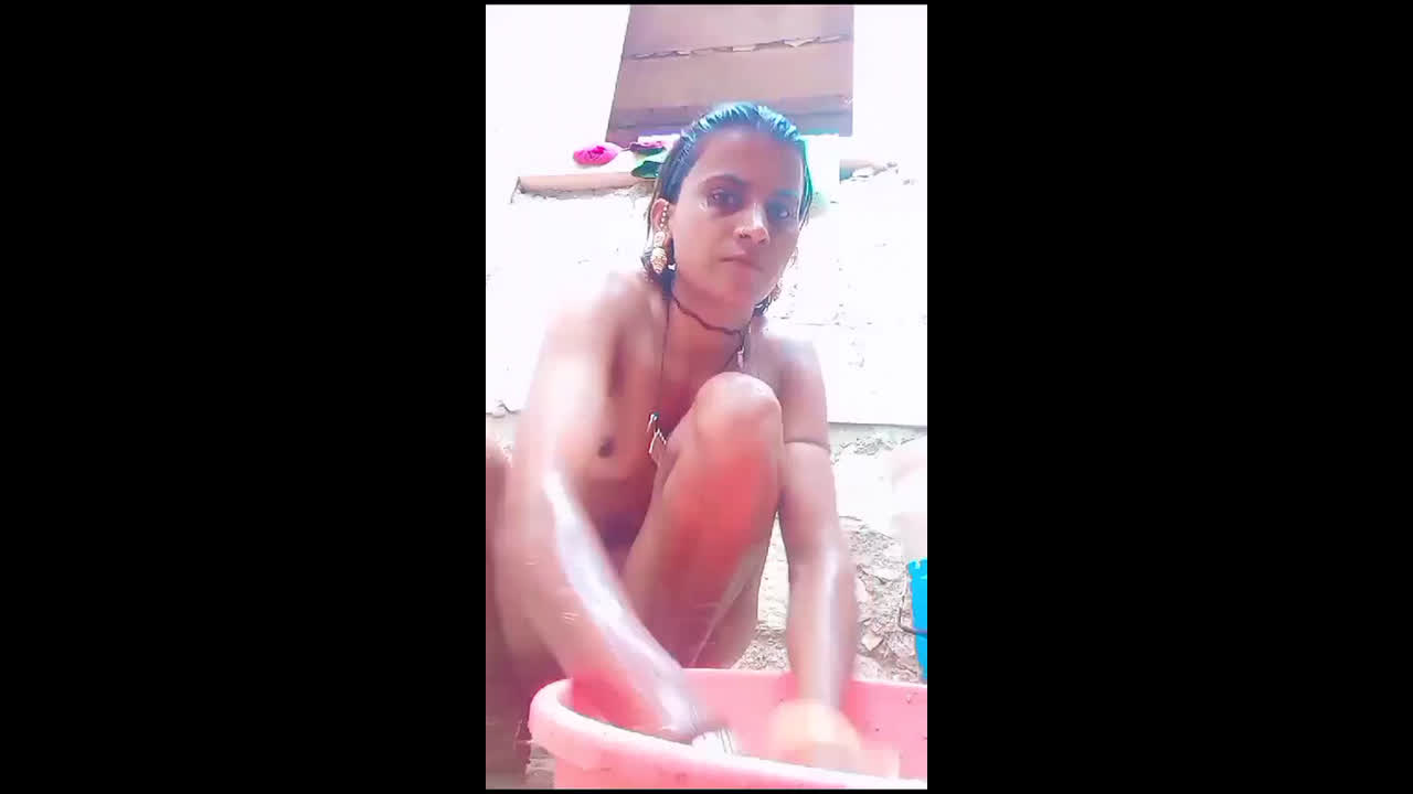 Village girl taking bath